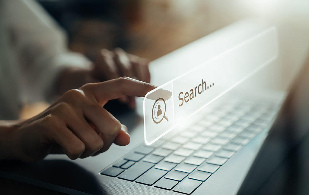 Hand using laptop and press screen to search Browsing on the Internet online. SEO