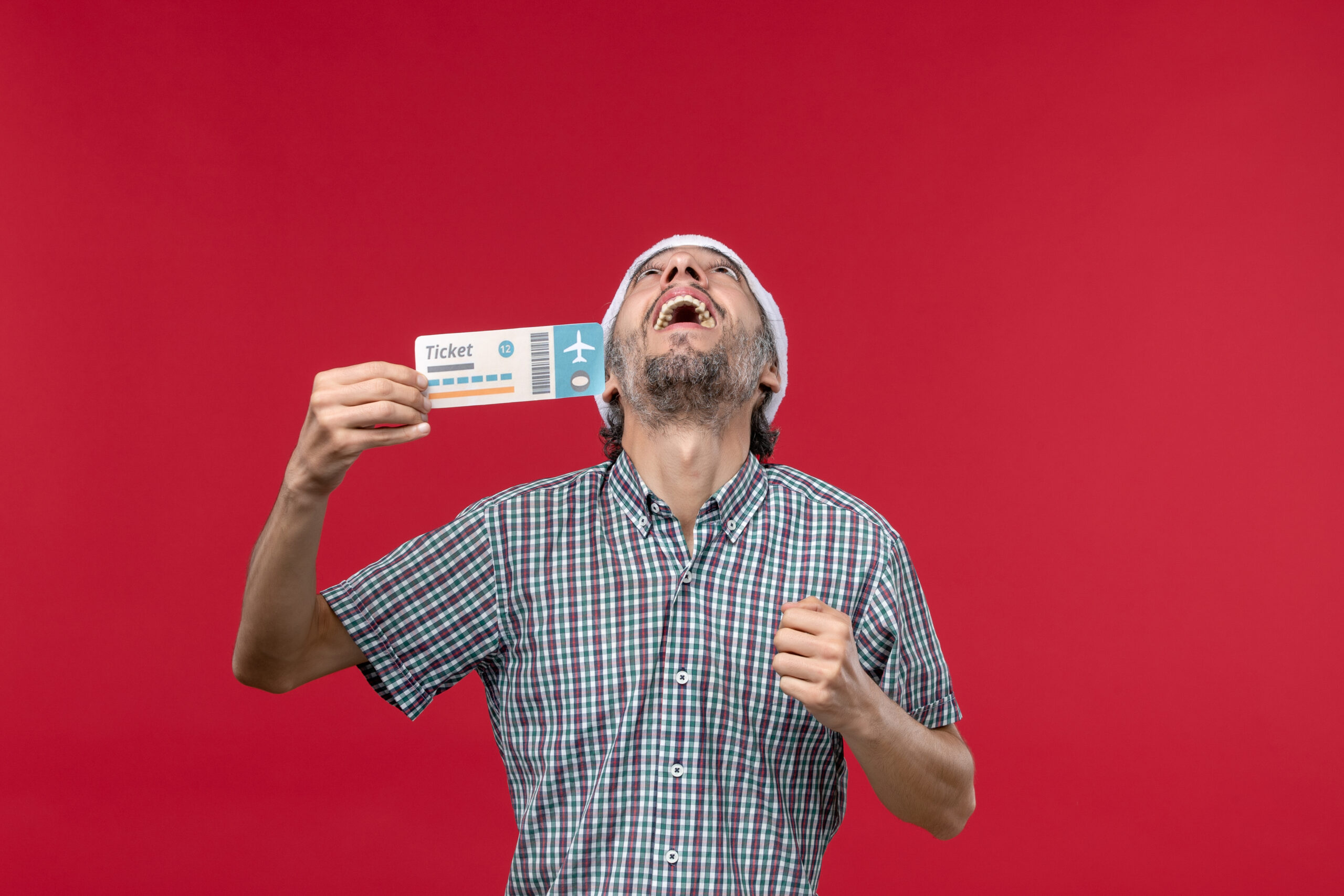 front view young male holding ticket red background scaled 1